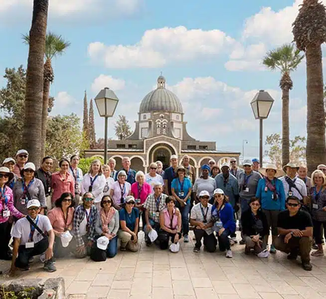 A pilgrimage group gathered at the Church of the Beatitudes